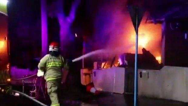 Firefighters battle a blaze at a home in Glebe in the early hours of the morning. 