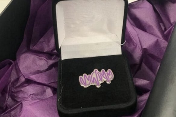A masters of cybernetics lapel pin.
