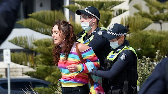 Police arrest a protester.