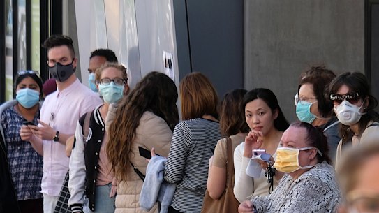 People lining up outside the Royal Melbourne Hospital's coronavirus clinic.