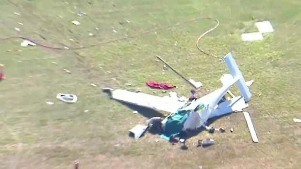 Wreckage strewn near the Caboolture airfield after two light planes crashed on Friday morning.