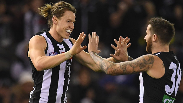 Tom Langdon (left) had a great finals series for Collingwood but is out of contract.