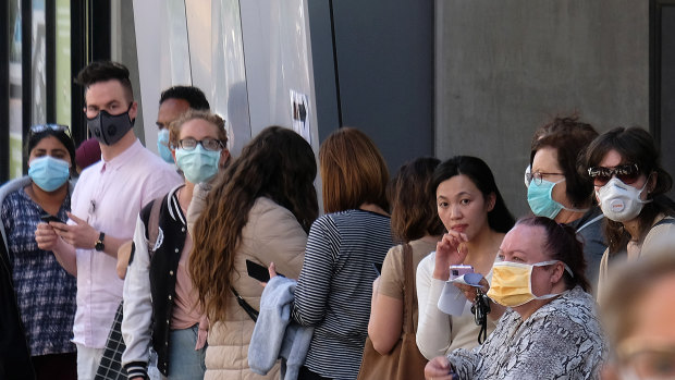 Queues outside the Royal Melbourne Hospital's coronavirus clinic.