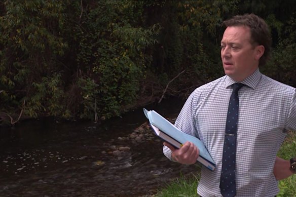 Detective Sergeant Flyn Loughlin stands in front of the Steavenson River on Monday.