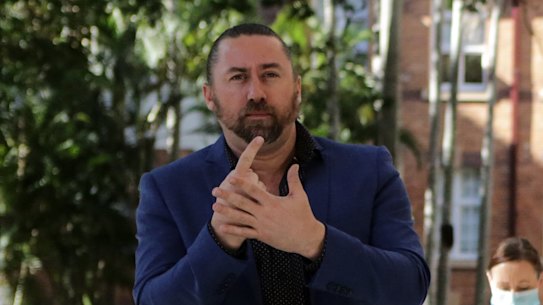 Auslan interpreter Mike Webb has been ordered into 14 days of mandatory home quarantine after being identified as a close contact.