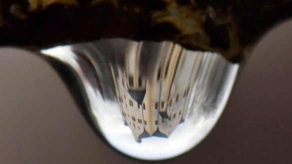 The historic Klaffenbach castle reflected in a rain drop in Chemnitz, Germany.