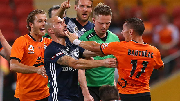 James Troisi of Victory blues with Eric Bautheac of the Roar before Bautheac was sent off.
