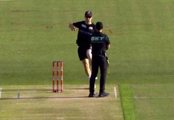 Sydney Sixers bowler Tom Curran runs at an umpire before a BBL match