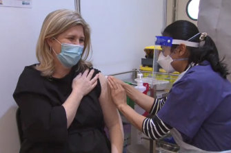 Victorian Deputy Chief Health Officer Clare Looker receives her first vaccine shot at the Melbourne Showgrounds site on Thursday.