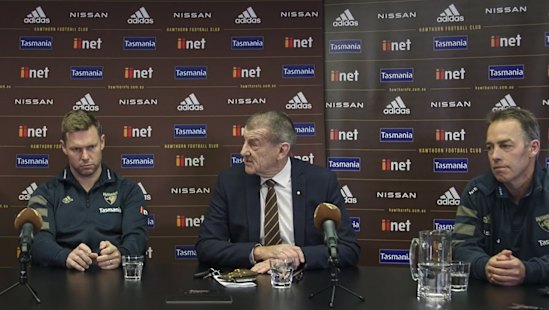 Sam Mitchell (left) and Alastair Clarkson flank Jeff Kennett at Hawthorn’s announcement of a coaching succession plan.