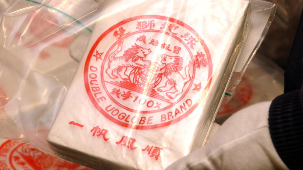 AFP show the heroin linked to the Pong Su that has infamous Double UO Globe Brand logo 