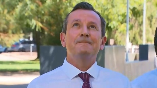 WA Premier Mark McGowan keeps an eye on a crow he dubbed ‘Clive’, which kept interrupting one of his press conferences during the week.