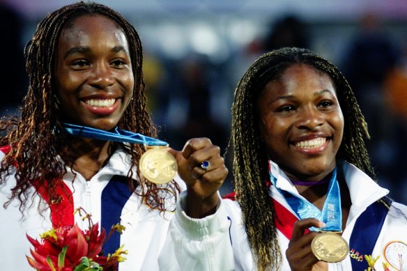 Sisters Venus and Serena Williams after winning gold in the women’s doubles at the Sydney 2000 Olympics.