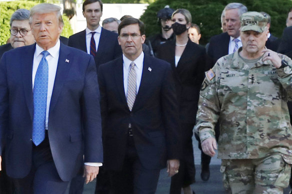 Front from left: Donald Trump, former defence secretary Mark Esper and chairman of the Joint Chiefs of Staff, General Mark Milley, in June.