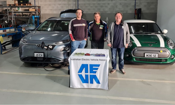 Queensland Electric Vehicles Association president Jon Day (left) with fellow members Graeme Manietta (centre) and Jeff Shaw and Jon’s  2019 electric Hyundai Kona.