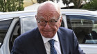 Rupert Murdoch, centre, and his wife, Elena Zhukova Murdoch, arrive at the Second Judicial District Court in Reno, Nevada, on Monday.
