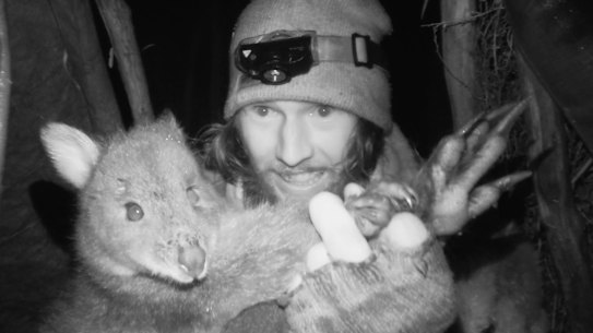 Shay Williamson on season three of Alone Australia with prize pademelon catch. 