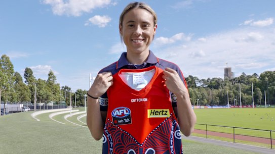 Aliesha Newman with the Indigenous jumper she designed for the Demons last year.