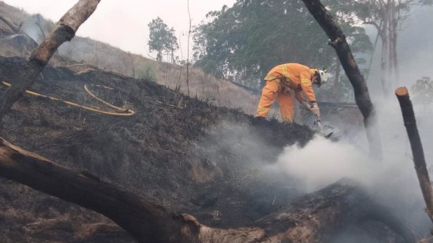 The Allandale Rural Fire Brigade dampening down bushfires in the Scenic Rim.