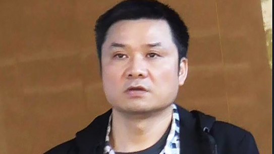 Binjun Xie, who was convicted of charges in Britain but entered Australia and is now linked to organised crime.