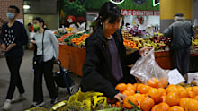 SYDNEY, AUSTRALIA - OCTOBER 22: People shop for fruit and vegetable produce at Paddy's Market on October 22, 2022 in Sydney, Australia. Treasurer Jim Chalmers will deliver the first Federal Budget for the Albanese Labor Government on October 25, 2022 - warning Australians to brace for spending cuts and limited cost-of-living relief. Focussing on rising inflation (6.1 per cent in the June Quarter) and a darkening world economy. The budget will include lower priced medicines, available from Januar