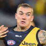 Richmond great Dustin Martin fends off Gold Coast and Geelong champion Dustin Martin.