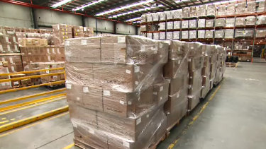 Three million rapid antigen tests, pictured in a Melbourne warehouse.