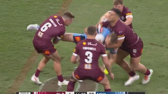 Cam Munster yanks at the leg of Tom Trbojevic.