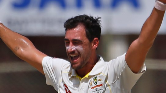 Mitchell Starc celebrates the wicket of Fawad Alam. 