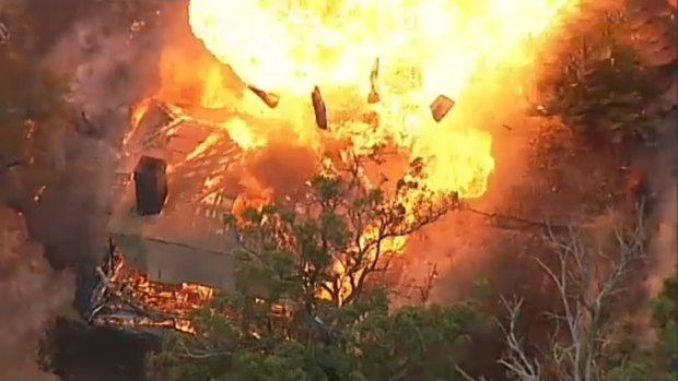 An aerial view of a house exploding in a massive fireball in Tonimbuk in the Bunyip State Forest.