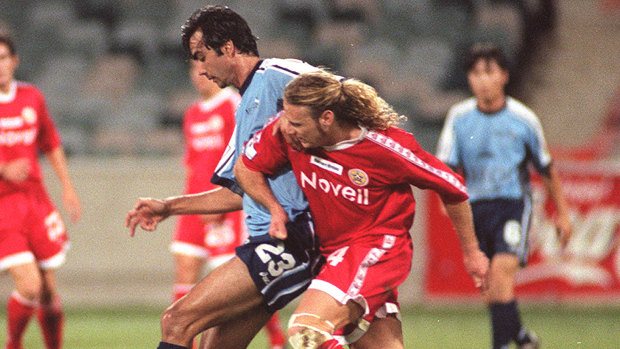 Paul Roberts, in red, played for the Canberra Cosmos from 1998-2000.