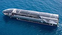 Christmas Island locals have woken to an unusual sight with a large rocket, belonging to Elon Musk’s SpaceX, towed in this morning by two large ships.