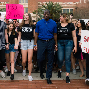 Democrat Andrew Gillum, as mayor of Tallahassee, marches with students seeking gun reform after the Parkland high-school shooting.