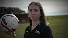One minute Ivy was charging down the field – the next, she was on the grass without a pulse – but she was saved by an on-site defibrillator and sheer luck.