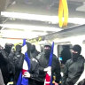 ‘Hateful and cowardly’: Melbourne train protest probed after Nazi salutes, antisemitic threats