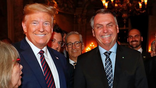 Brazil’s President Jair Bolsonaro, centre, with President Donald Trump during a dinner in Florida last year.