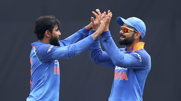 Dominant: India's Ravindra Jadeja (left) celebrates with captain Virat Kohli during their lopsided victory.