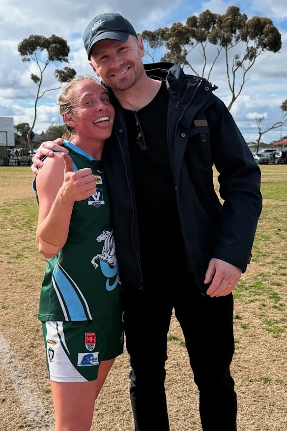 Mardi and Patrick Dangerfield celebrate her flag with Geelong Amateurs last weekend. 