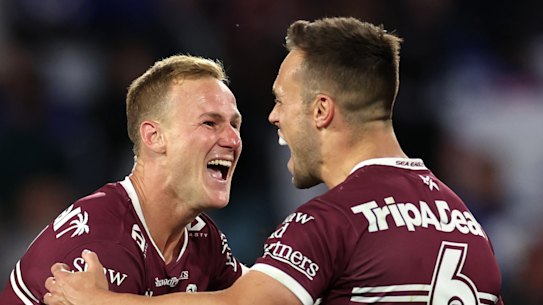 Daly Cherry-Evans celebrates with Luke Brooks.