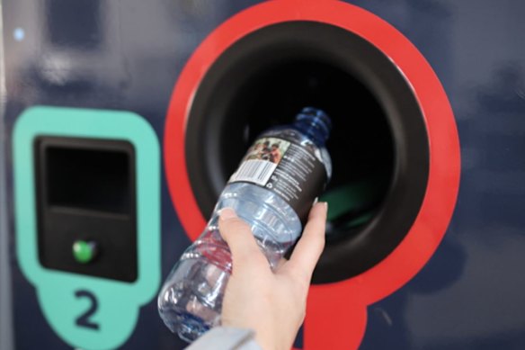 A reverse vending machine where clean containers are sorted and vouchers are issued.