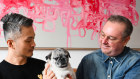 Yao-Chung Chang and Jason Coates with their pug Valentino who cost $20,000 to bring to Australia when they moved here from Japan.