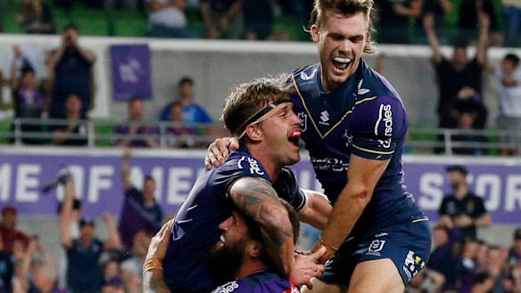 Cameron Munster celebrates another Storm try.