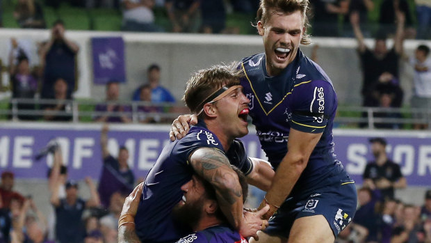 Cameron Munster celebrates another Storm try.