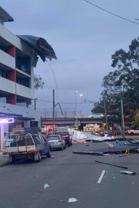 A roof was ripped off a building, falling onto parked cars along Beames Road, Mount Druitt. 