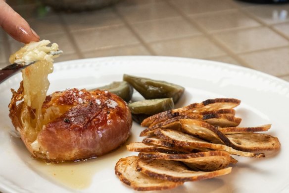 At Grana, shoppers can sit down for snacks such as baked brie.