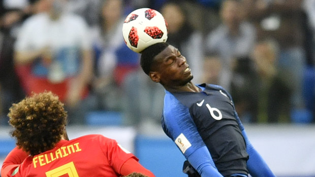Belgium's Marouane Fellaini and France's Paul Pogba challenge for the ball during their semi-final.