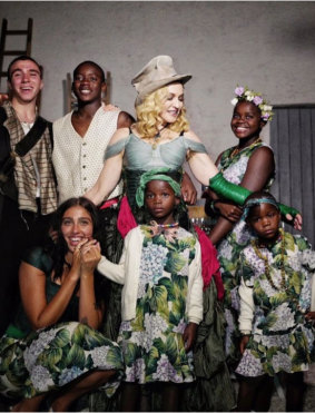 Madonna with her six children, four of whom are adopted from Malawi in south-eastern Africa.
