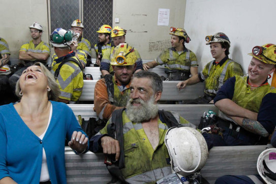 Then premier Kristina Keneally shares a joke with miner Chris Evans in Russell Vale in 2011.