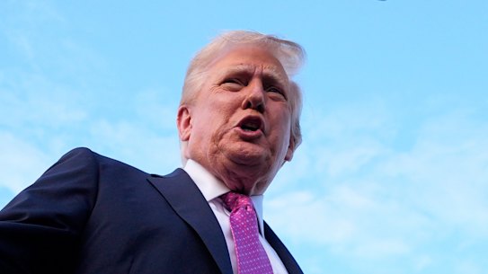 Donald Trump speaks to reporters before boarding Air Force One at New Jersey on Sunday.