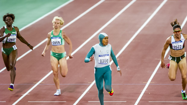 Cathy Freeman hits the winning line.